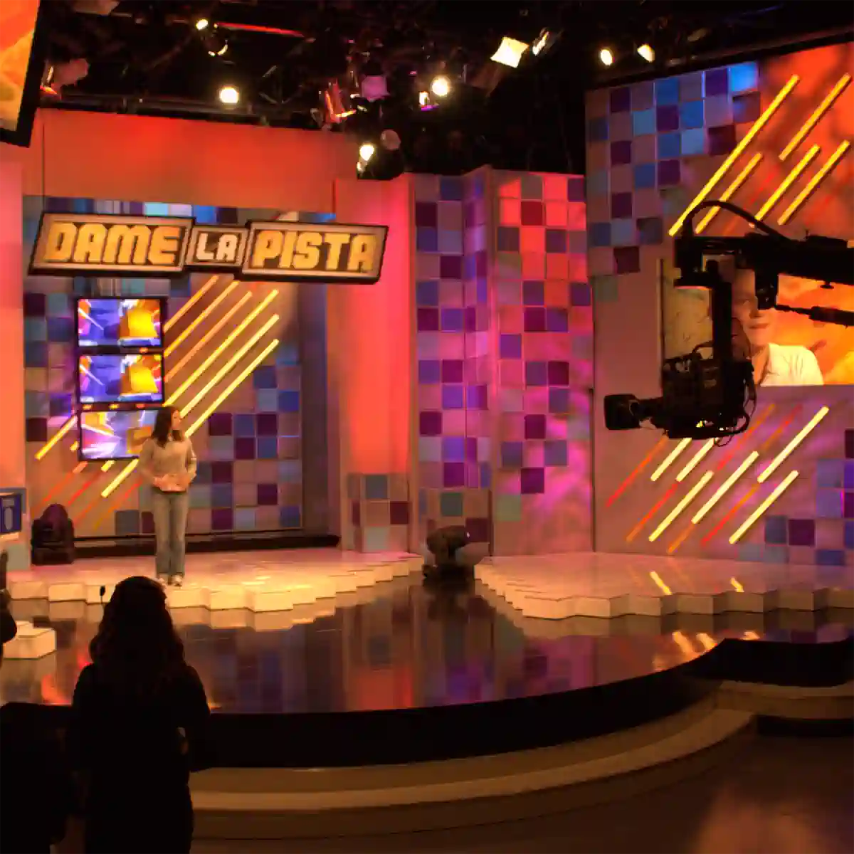 Behind the scenes shot of live gameshow produced by Outpost Worldwide showing off a large live video production set.